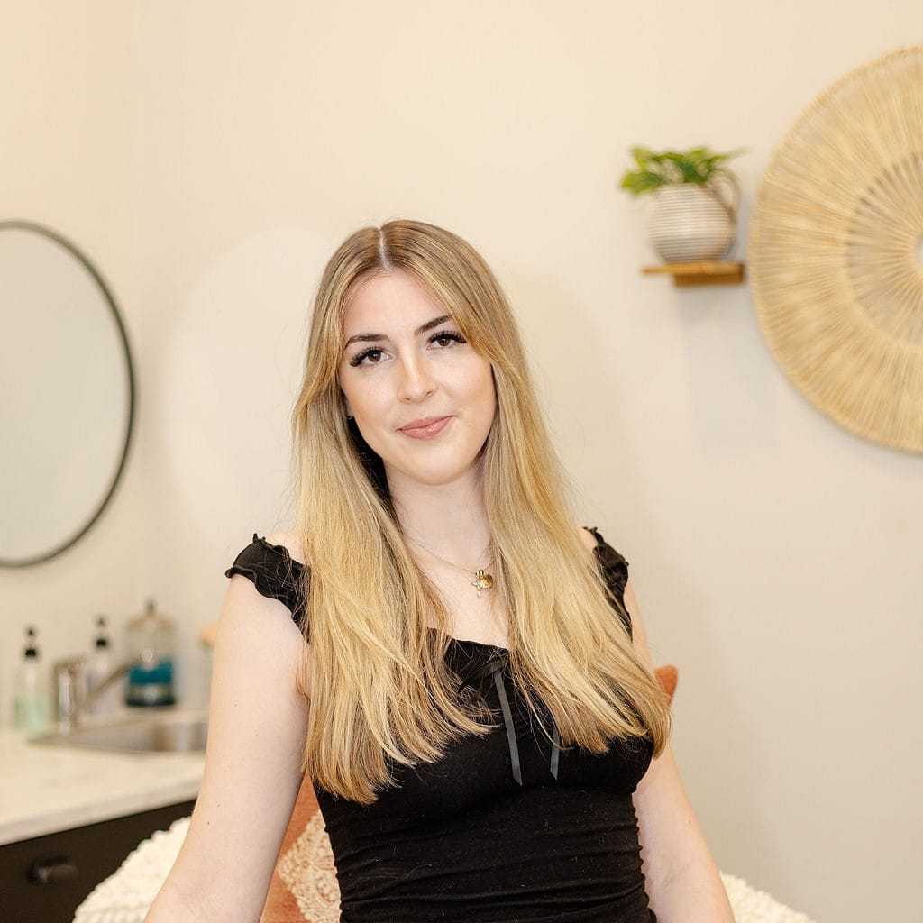 Portrait of Camdyn S., a professional stylist at CARMA salon & spa, showcasing their expertise and style.