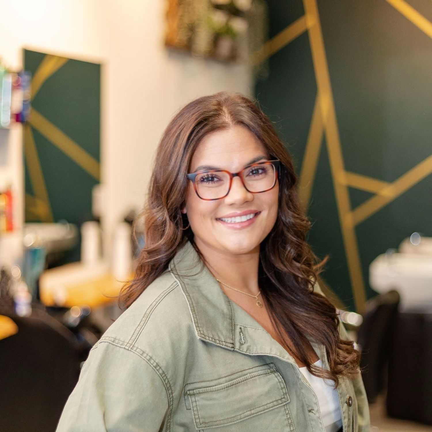 Portrait of Gabriella B., a professional stylist at CARMA salon & spa, showcasing their expertise and style.