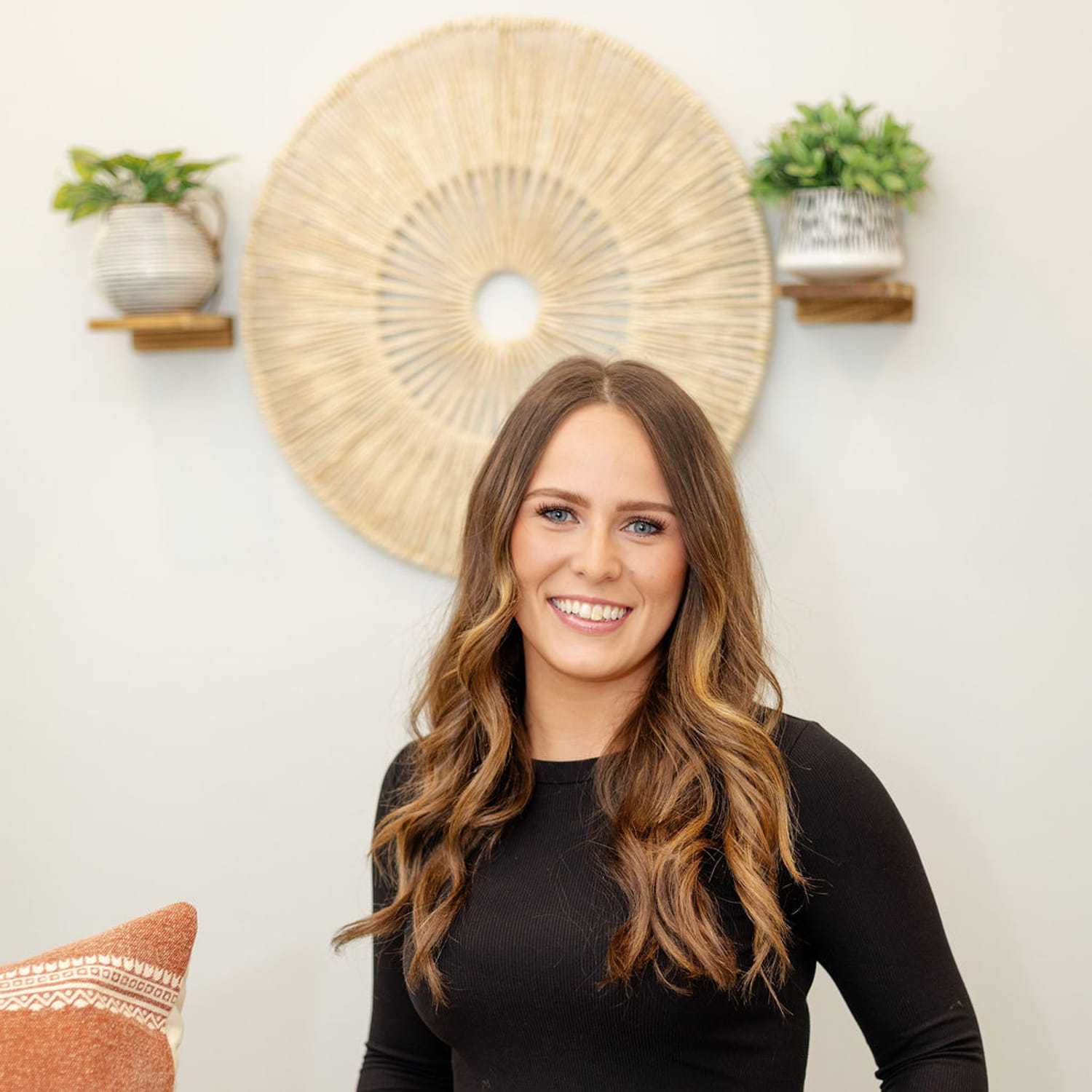 Portrait of Dianna A., a professional stylist at CARMA salon & spa, showcasing their expertise and style.