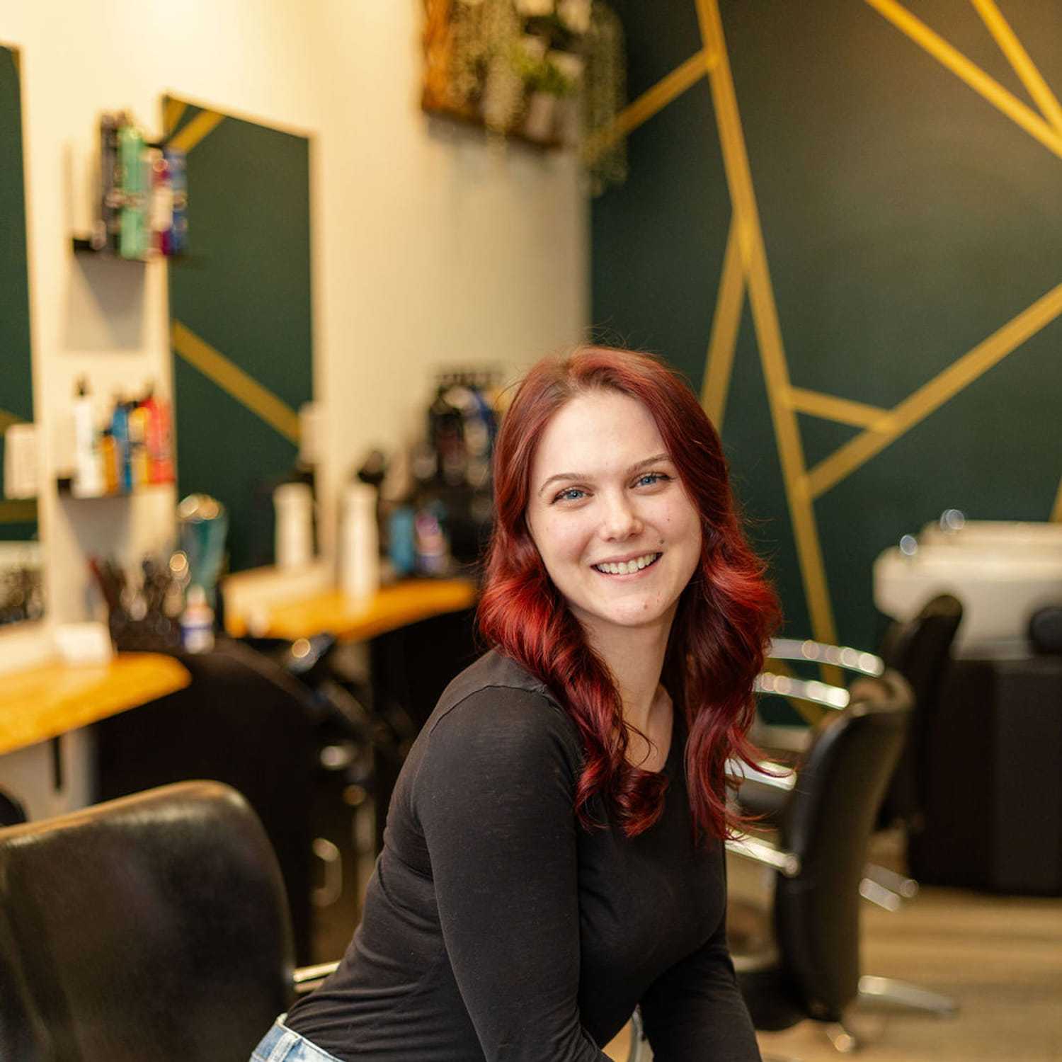 Portrait of Jill M., a professional stylist at CARMA salon & spa, showcasing their expertise and style.