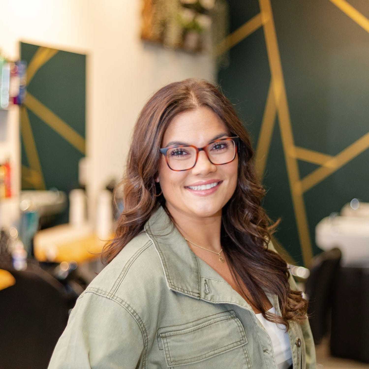 Portrait of Gabriella B., a professional stylist at CARMA salon & spa, showcasing their expertise and style.